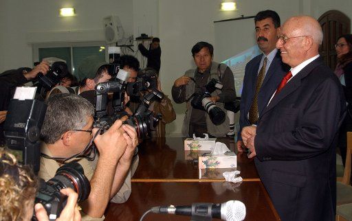 Palestinian Prime Minister Ahmed Qureia is photographed by the press after  the Palestinian Legislative Council meeting   in Ramallah West BankNovember 12 2003. {UPI Photo\/Debbie Hill}