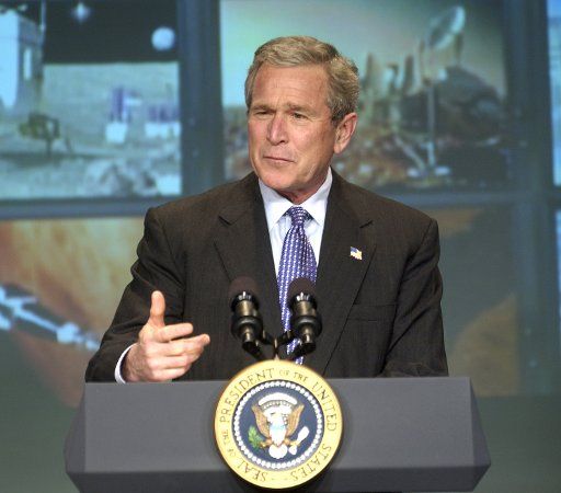 President George W. Bush addresses those gathered at NASA headquarters in Washington to announce his plans to expand the space program on January 14 2004. The president\