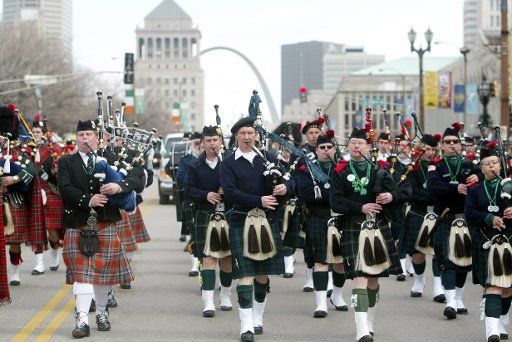 Bagpipers march down Market Street during the St. Patricks Day Parade in St. Louis on March 13 2004. An Estimated 350 thousand people lines the parade route to watch the colorful parade with mild temperatures.(UPI Photo\/Bill Greenblatt)