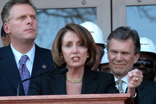 House Minority Leader Nancy Pelosi speaks during a ceremony unveiling the remodeled Democratic National Headquarters on March 25 2004 in Washington. On the left is DNC Chairman Terry McAuliffe and on the right is Sen. Tom Daschle.   (UPI Photo\/Rick...