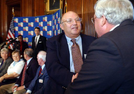 House Speaker Dennis Hastert right shakes hands with AARP President James G. Parkel before a news conference in favor of the prescription drug bill on November 21 2003 on Capitol Hill in Washington. Proponent argue the bill would bring a needed...