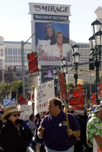 Protesters march along the Las Vegas strip where President George W. Bush spoke at a fund raiser at the Venetian Hotel in Las Vegas NV on November 25 2003. (UPI Photo\/Roger Williams)
