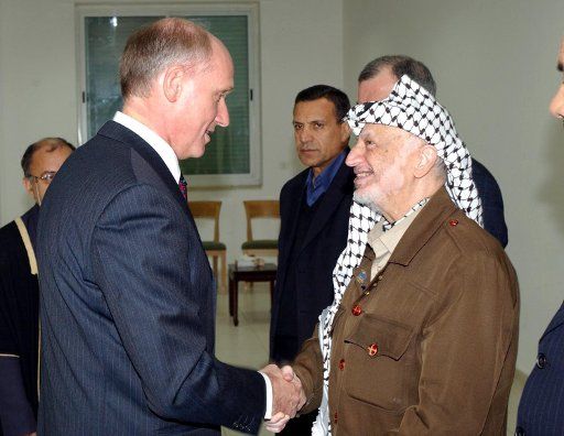 Dutch representative to the PNA France Buotait is greeted by Palestinian leader yasser Arafat in Ramallah on December 7 2003. (UPI Photo\/Omar Rashidi\/Palestinian Authority)