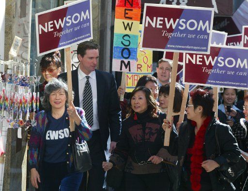 Gavin Newsom Democratic candidate for Mayor of San Francisco walks through Chinatown with supporters Dec. 8 2003 in San Francisco. Newsom is running against Green Party candidate Matt Gonzalez in a tight race.  (UPI Photo\/Terry Schmitt)