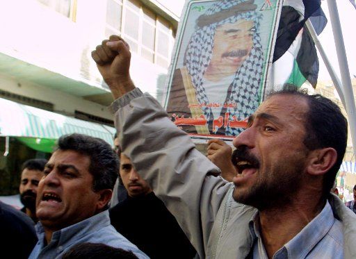 Palestinians demonstrate agains the United States and against the capture of the ousted Iraqi president Saddam Hussein in Khan Younis south of Gaza City December 15 2003.      (UPI Photo\/Ismael Mohamad)