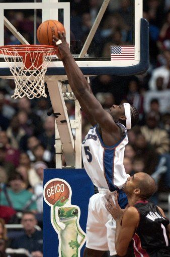 Kwami Brown of the Washington Wizards dunks in a game against the Miami Heat on Dec. 26 2003 at the MCI Center in Washington.  Brown finished the game with 10 points.  The Heat defeated the Wizards 92-84  (UPI Photo\/Mark Goldman)