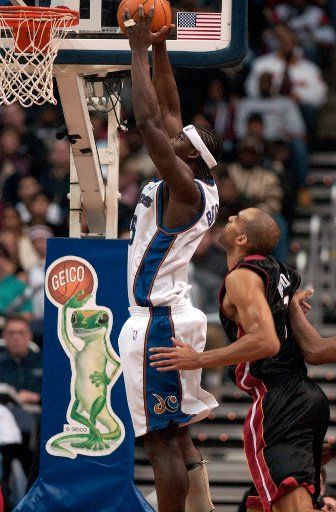 Kwami Brown of the Washington Wizards dunks in a game against the Miami Heat on Dec. 26 2003 at the MCI Center in Washington.  Brown finished the game with 10 points.  The Heat defeated the Wizards 92-84.  (UPI Photo\/Mark Goldman)