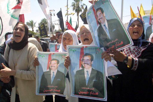 Palestinians shout anti American slogans while they hold posters of former Iraqi leader Saddam Hussein on April 12 2004 during a demonstration against the US-led war in Iraq in Gaza city. (UPI photo\/Ismael Mohamad)