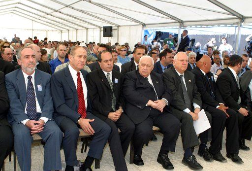Israeli Prime Minister Ariel Sharon center attends a ceremony marking Memorial Day eve at a soldiers\
