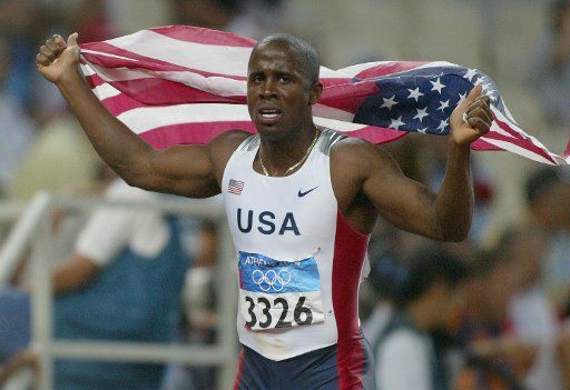 Dwight Philips of the USA celebrates gold in the men\