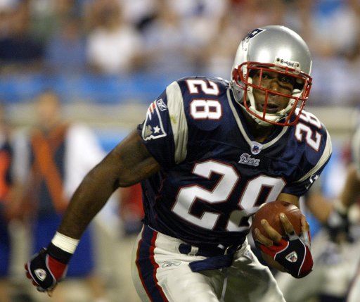 New England Patriots running back Corey Dillon rushes against the Carolina Panthers in preseason action in the first half at Bank of America Stadium in Charlotte N.C. on Saturday Aug. 28 2004. (UPI Photo\/Nell Redmond)