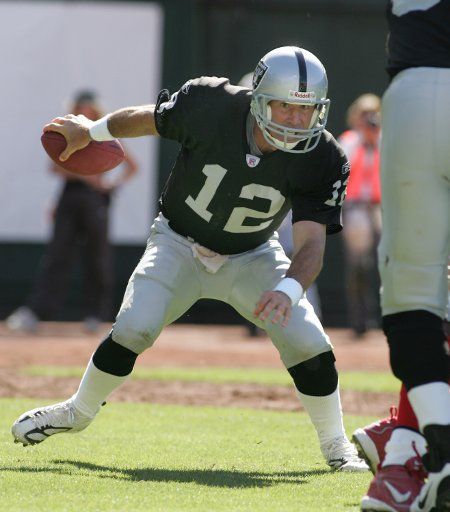 Oakland Raiders QB Rich Gannon ducks out of the pocket against the Buffalo Bills at the Network Associates Coliseum in Oakland California on September 19 2004.  The Raiders defeated the Bills 13-10.     (UPI Photo\/Terry Schmitt)