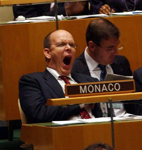 His Royal Highness Prince Albert of Monaco fights tedium and poses for pictures while awaiting to address the 59th session of the United Nations General Assembly on Sept. 23 2004.  (UPI Photo\/Ezio Petersen)