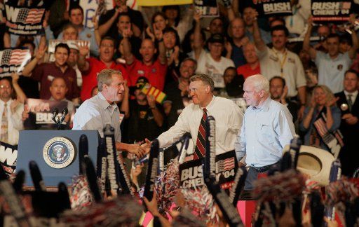 Senators John McCain (rt) and Jon Kyl greet United States President George W. Bush (left) at a campaign stop in Phoenix August 11 2004.     (UPI Photo\/Will Powers)     