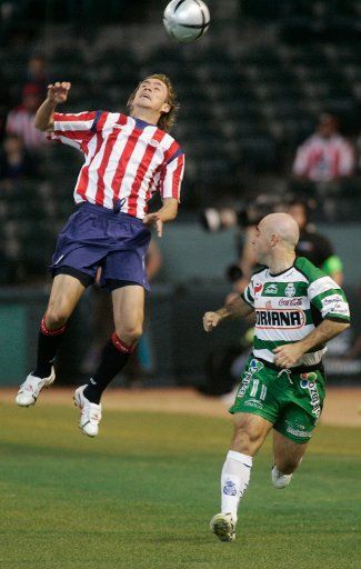 Guadalajara Chivas Rafael Medina blocks a pass to Santos laguna Rodrigo Ruiz in the first half action at Bank One Ballpark Jan. 2 2005 in Phoenix AZ.     (UPI Photo\/Will Powers)     