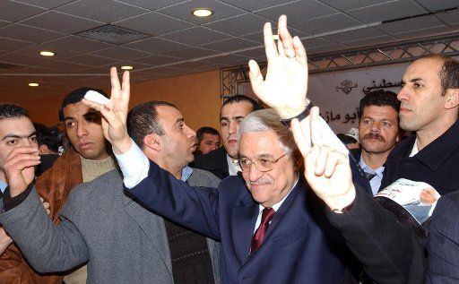 Mahmoud Abbas celebrates winning the Palestinian presidential election with supporters at the Muqataa in Ramallah on January 9 2005.  (UPI Photo\/Omar Rashidil) 