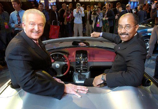 General Motors President North America Gary Cowger (left) and GM Vice President Design Ed Welburn sit in the new 2007 Saturn Sky Roadster after its unveiling at the North American International Auto Show in Detroit on January 9. 2005. The two-seat...