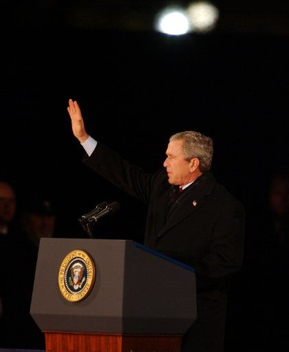 President George W. Bush waves to the crowd on the National Ellipse to celebrate the men and women in the armed services on January 19 2005 in Washington.  The ceremony is part of Bush\
