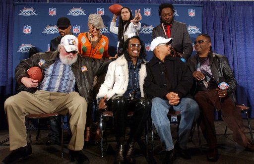 Charlie Daniels lower left The Black Eyed Peas rear and Earth Wind and Fire lower right appear at a news conference to discuss their pre-game performances for Super Bowl XXXIX on Feb. 4 2005 in Jacksonville Fla.   (UPI Photo\/Roger L. Wollenberg)