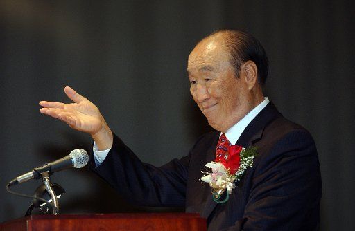 Rev. Sun Myung Moon greets the audience during a stop on his North American speaking tour in Arlington Va. on Oct. 28 2004.    (UPI Photo\/Roger L. Wollenberg)