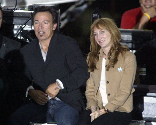 Bruce Springsteen and his wife Patti Scialfa watch from the as Senator John Kerry speaks at a presidential campaign rally at the Bayfront Park Amphitheatre in Miami  Florida on October 29 2004.  (UPI Photo\/Michael Bush)