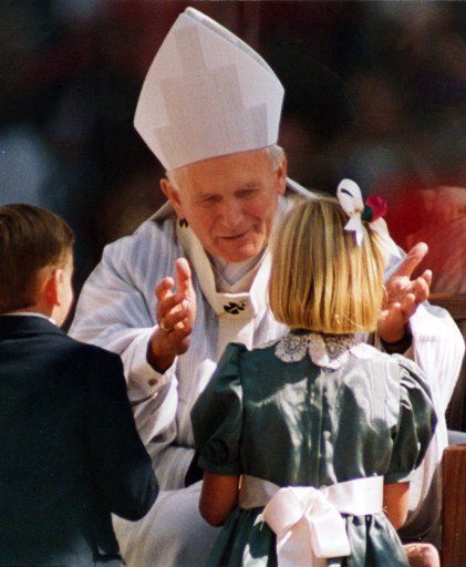 Pope John Paul II is resting in the hospital February 25 2005 following an emergency tracheotomy to ease his breathing. The Pope is seen here in this September 18 1987 file photo greeting Jennifer Scales and Daniel Giraudo during Mass at Candlestick...