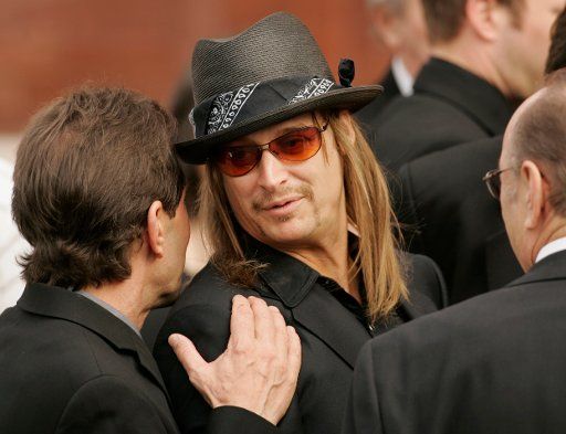Greg Oswald (left) talks with Kid Rock following the funeral for country music legend Merle Kilgore on Tuesday February 15 2005 at the Ryman Auditorium in Nashville Tennessee. Oswald is Hank Williams Jr.\