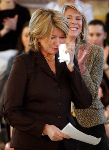 Susan Lyne CEO of Martha Stewart Living Omnimedia (right) looks on while Martha Stewart wipes a tear from her cheek after  addressing  her employees on 3\/7\/05 at a staff meeting held at the New York corporate offices of Martha Stewart Living...