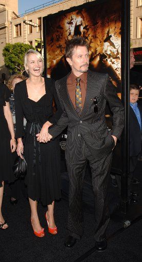Actror Gary Oldman arrives with his girlfriend Alisa Marshall for the premiere of "Batman Begins" June 6 2005 at Grauman\