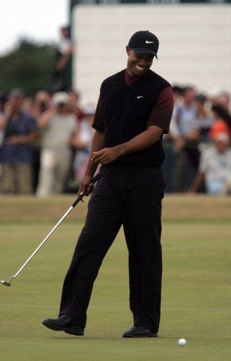 American golfer Tiger Woods laughs after getting a bogey on the 10th hole during the final round of the 2005 British Open Championship on the Old course of St.Andrews on Sunday July 17 2005. (UPI Photo\/Hugo Philpott)