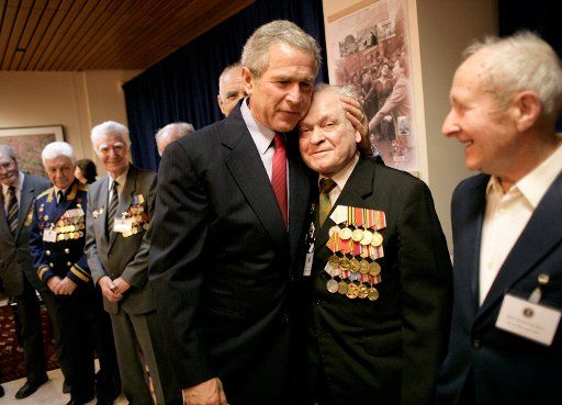 During a meeting with U.S. and Russian veterans President George W. Bush hugs Russian veteran Vasik Ivanovich Korneer after he offered the President a coin from his service in Berlin during World War II  in Moscow Monday May 9 2005. President Bush...