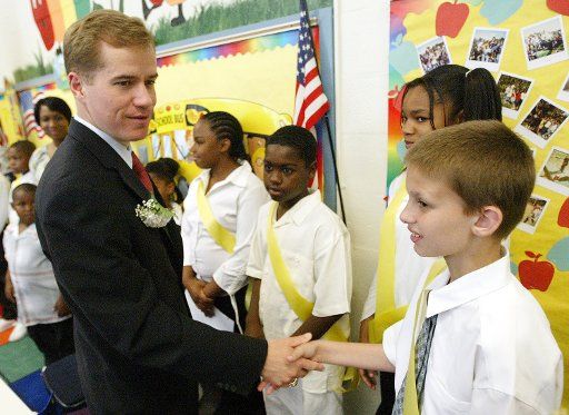Missouri Gov. Matt Blunt shakes hands with children while visiting the Cool Valley Elementary School in Cool Valley MO on May 25 2005. Blunt was on hand to announce that he has signed into law a bill that will provide Missouri classrooms with a $158...