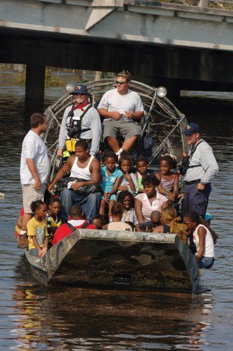 Residents are evacuated from their homes in New Orleans by a FEMA Urban Search and Rescue team on August 31 2005.  (UPI Photo\/Jocelyn Augustino\/FEMA)