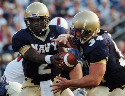 U.S. Naval Academy Midshipmen Quarterback Lamar Owens hands off to fullback Matt Hall in the first quarter of play against the Stanford Cardinal at Annapolis MD on September 20 2005.   (UPI Photo\/Damon J. Moritz\/Navy)