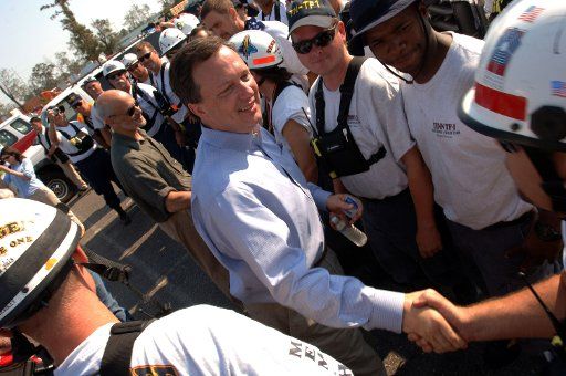 Michael D. Brown Department of Homeland SecurityÕs Principal Federal Official for Hurricane Katrina shakes hands with the Tennessee Task Force 1 members in New Orleans on September 4 2005.  Behind Mike Brown is Secretary of Homeland Security Michael...
