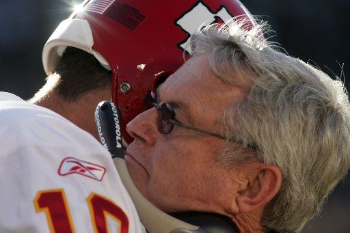 Kansas City Chiefs Head Coach Dick Vermeil hugs quarterback Trent Green on the sideline before the game against the Oakland Raiders September 18 2005 in Oakland CA.  (UPI Photo\/Terry Schmitt)