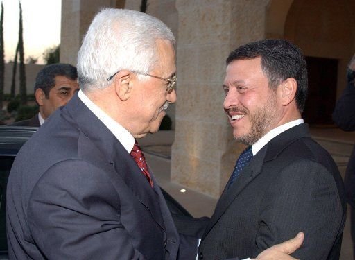 Palestinian leader Mahmoud Abbas is greeted by King Abdullah II in Ahman Jordan on Oct. 24 2005. Abbas arrived from Cairo where he met with Egyptian President Hosni Mubarak.  (UPI Photo\/Omar Rashidi\/HO)