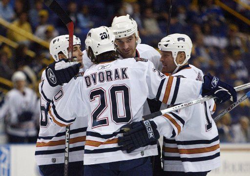 Edmonton Oilers Jarret Stoll (L) Radek Dvorak (20) and Raffi Torres (R) congratulate Alexei Sernenov on his goal in the first period against the St. Louis Blues at the Savvis Center in St. Louis on November 4 2005. (UPI Photo\/Bill Greenblatt)