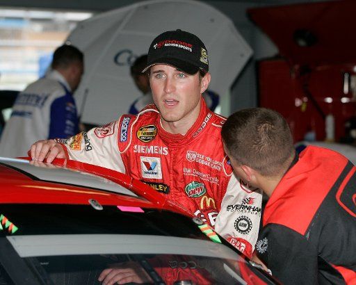NASCAR Nextel Cup driver Kasey Kahne climbs into his car for the beginning of practice in the garage area at the Homestead-Miami Speedway in Homestead  Florida on November 18 2005.  (UPI Photo\/Michael Bush)