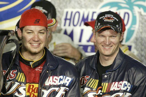 Martin Truex Jr(L) and co car owner Dale Earnhardt Jr celebrate winning the NASCAR Busch series championship after finsihing 7th in the Ford 300 race at the Homestead-Miami Speedway in Homestead  Florida on November 19 2005.  (UPI Photo\/Michael Bush)