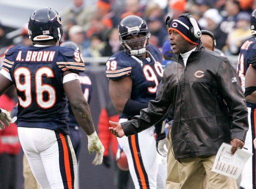 Chicago Bears head coach Lovie Smith right talks to defensive end Alex Brown (96) as the play the Carolina Panthers during the third quarter November 20 2005 at Soldier Field in Chicago. The Bears won 13-3. (UPI Photo\/Brian Kersey)