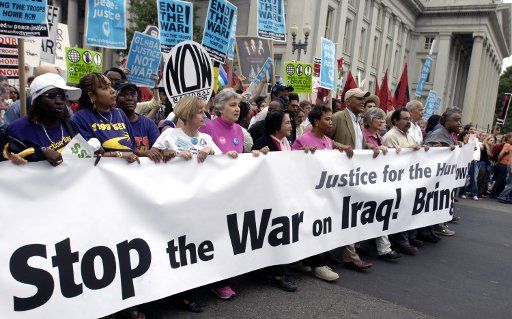 Anti-War demonstrators march up 15th street during a rally in Washington on Sept. 24 2005. Thousands of anti-war demonstrators rallied outside the White House demanding the withdrawal of US troops from Iraq.  (UPI\/Photo Kevin Dietsch)  