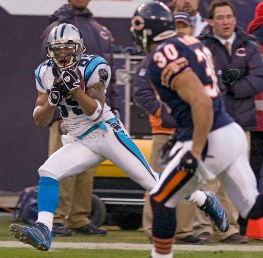 Carolina Panthers receiver Steve Smith left hauls in a 58-yard touchdown reception as Chicago Bears safety Mike Brown right pursues during the first quarter of the NFC Divisional playoff game at Soldier Field in Chicago on January 15 2006. (UPI...