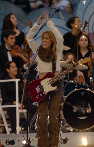 Sheryl Crow performs at halftime of the Dallas Cowboys-Denver Broncos NFL game November 24 2005 in Irving Texas.  The performance kicked off the Salvation Army\