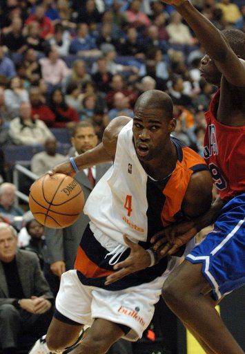 Antawn Jamison (4) of the Washington Wizards drives to the basket and is fouled by Luol Deng (9) of the Chicago Bulls on December 10 2005 in the second quarter at the MCI Center in  Washington D.C.  The Bulls defeated the Wizards 118-111.   (UPI...