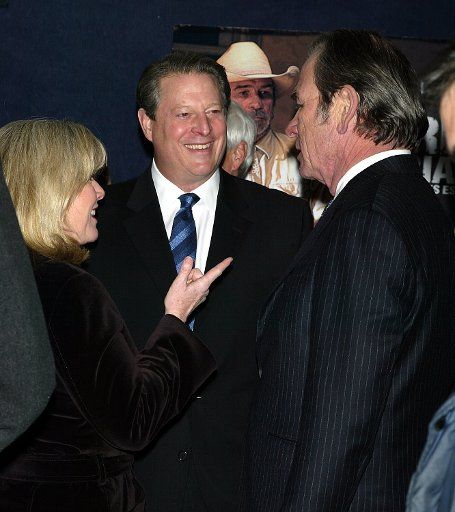 Tommy Lee Jones (right) Tipper Gore and Al Gore arrive for the premiere of "The Three Burials of Melquiades Estrada" at the Paris Theater in New York on December 12 2005.   (UPI Photo\/Laura Cavanaugh)