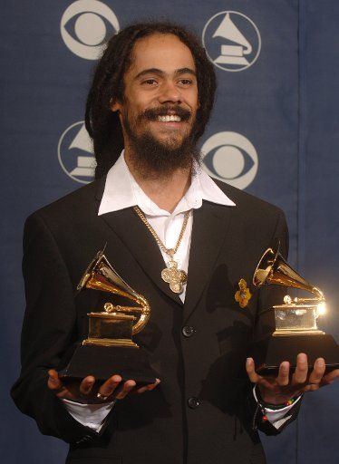 Damian Marley holds his two Grammys for Best Reggae Album and Best Urban\/Alternative Performance at the 48th Annual Grammy Awards at the Staples Center in Los Angeles on February 8 2006.  (UPI Photo\/Phil McCarten)  