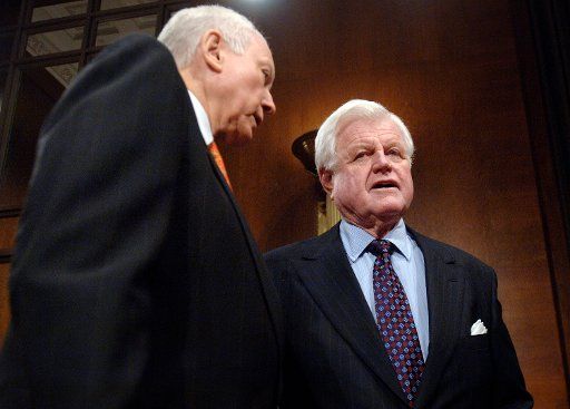 Sen. Orrin Hatch (R-UT) (L) talks to Sen. Edward Kennedy (D-MA) before the Judiciary Committee vote on the nomination of Samuel Alito to Justice of the Supreme Court in Washington on January 24 2006.  (UPI Photo\/Kevin Dietsch)   