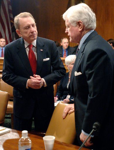 Chairman of the Senate Judiciary Committee Sen. Arlen Specter (R-PA) (L) talks to Sen. Edward Kennedy (D-MA) before the commitee\