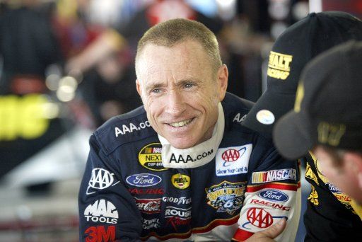 NASCAR race car driver Mark Martin talks with members of the AAA Ford before the start of practice for the DIRECTV 500 at the Martinsville Speedway in Martinsville VA on March 31 2006. (UPI Photo\/Nell Redmond)